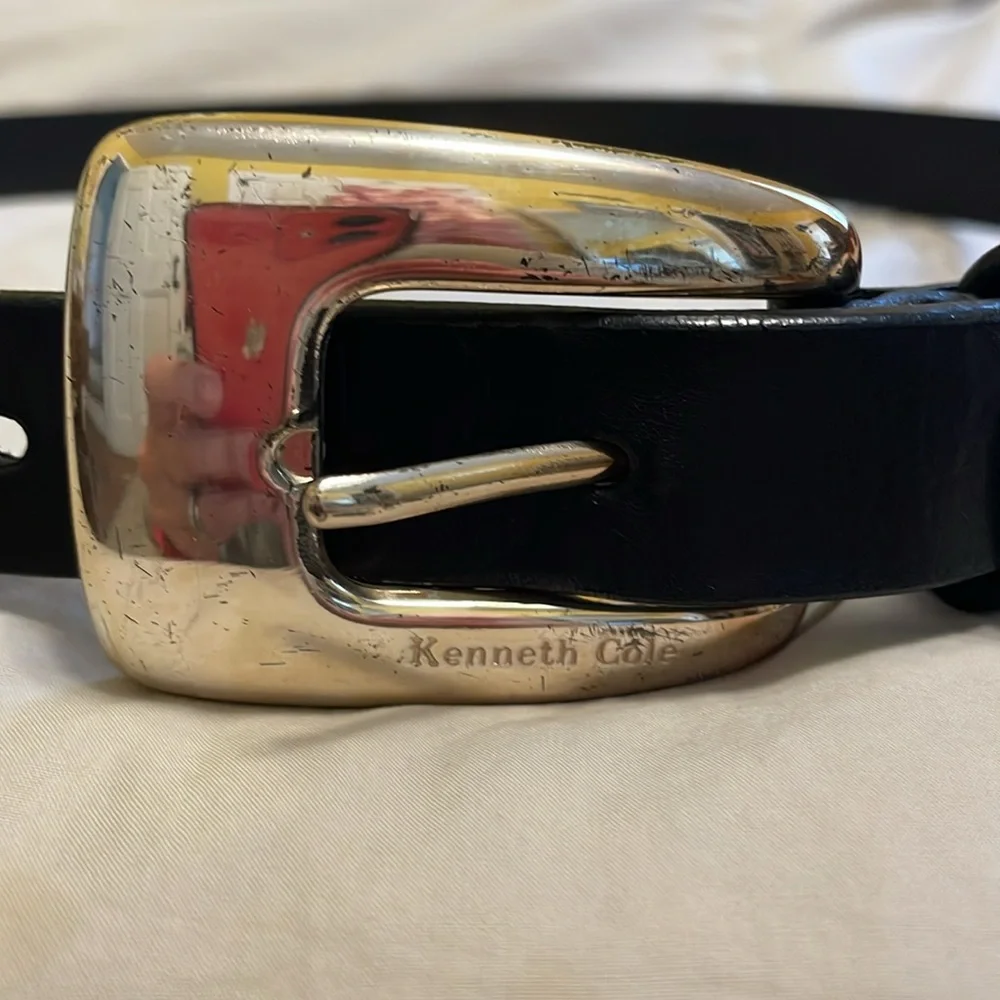 Genuine leather belt from Kenneth Cole. Metal buckle. Measures about 35 inches.